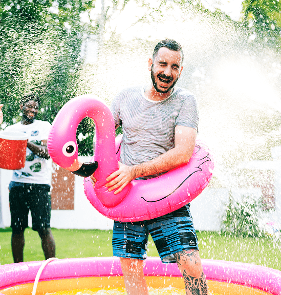 diverse group friends enjoying summer time splashing water Corporate Events